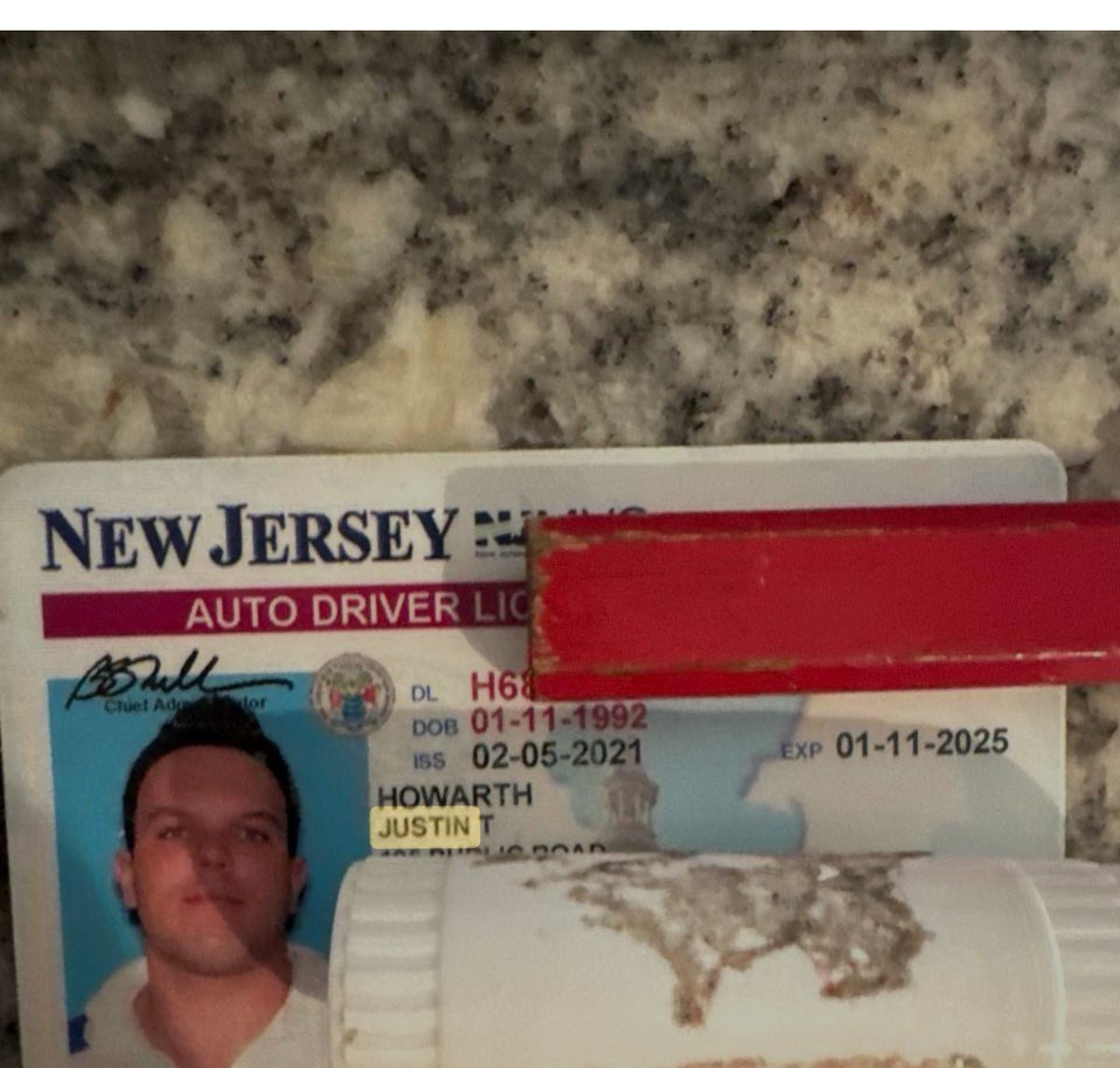 New Jersey driver's license photo showing the name Howarth, Justin T